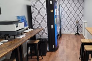 room with vending machines and computer with printer