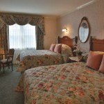 Rehoboth Beach DE Victorian hotel standard room with two beds and wardrobe
