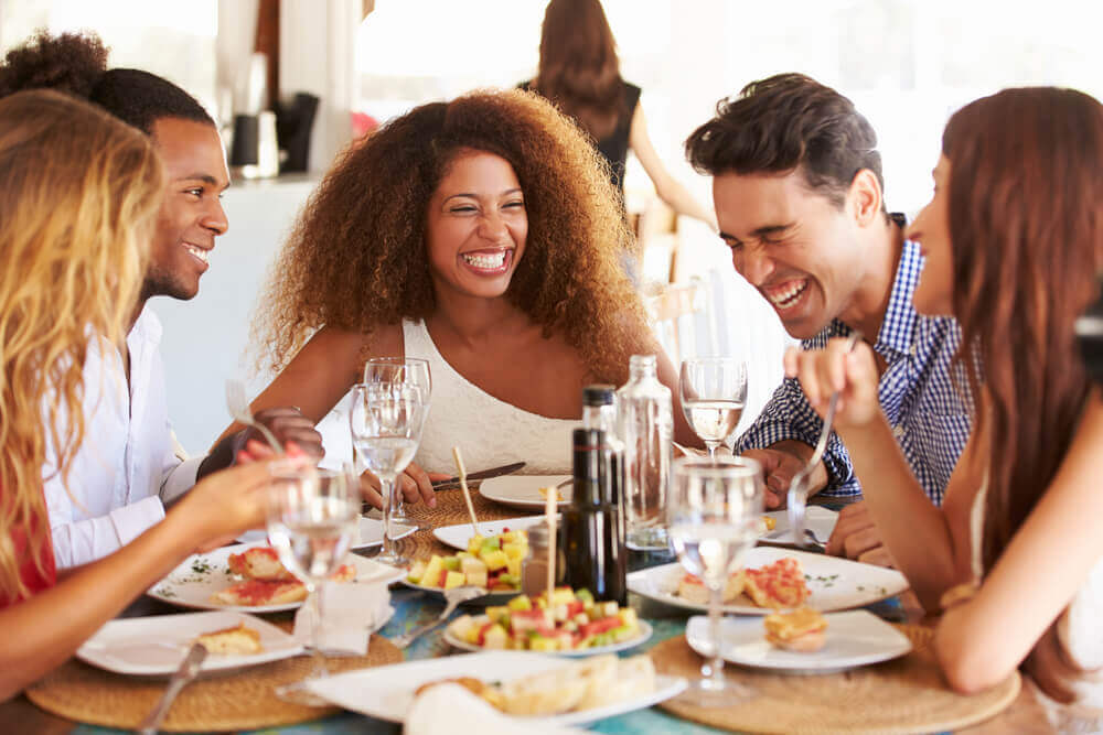 A group of friends enjoy a meal at a Rehoboth Beach restaurants.