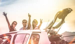 Friends driving to one of the best places to go for spring break
